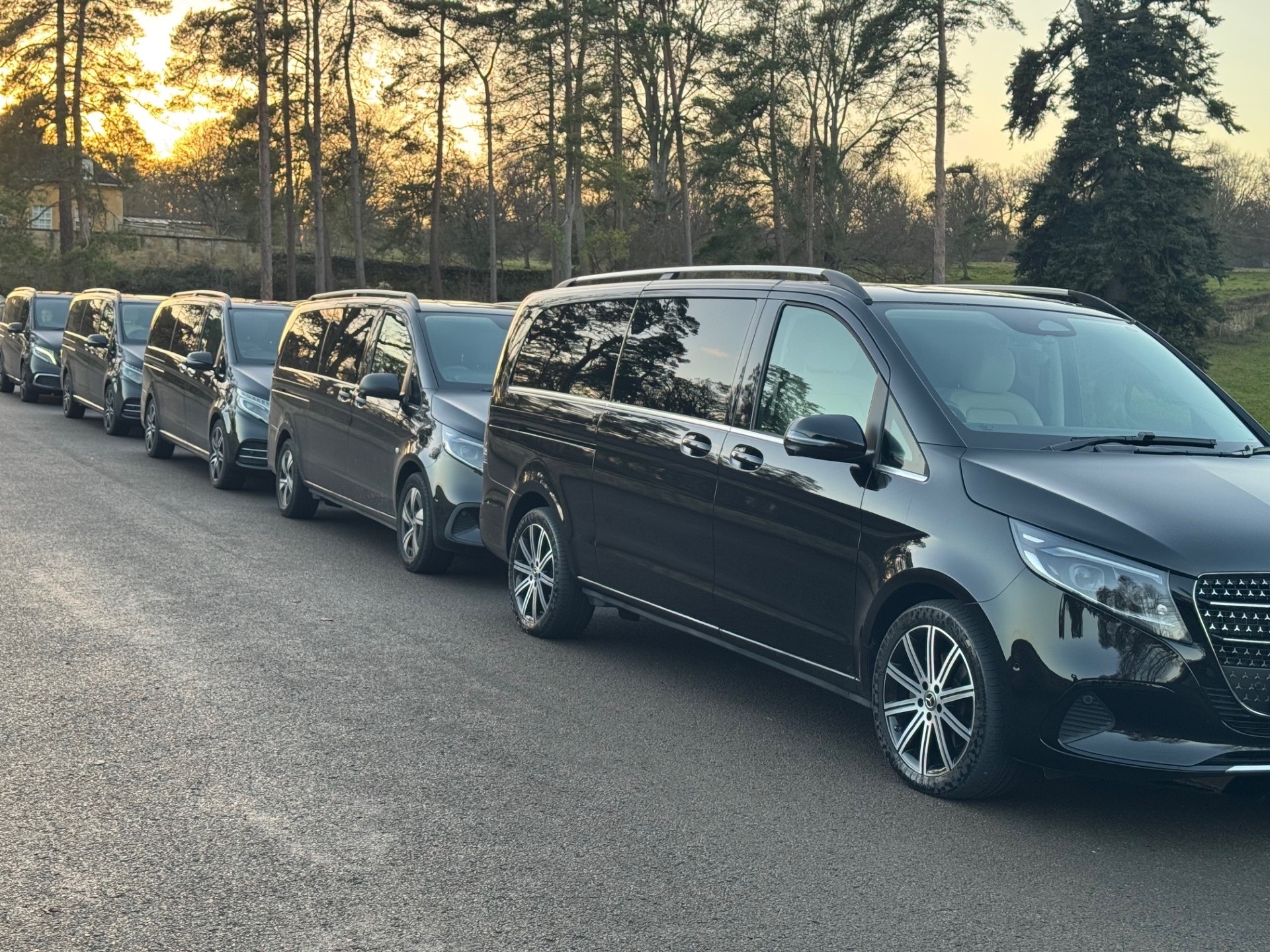 Oxford Chauffeurs fleet lineup at sunset